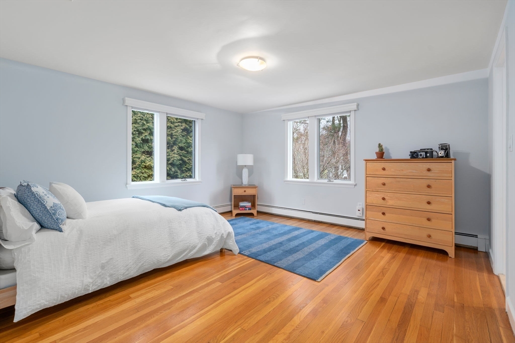 81 Woodfall Road Belmont, MA 02478 - Photo 20 of 37 a bedroom with a bed and wooden floor
