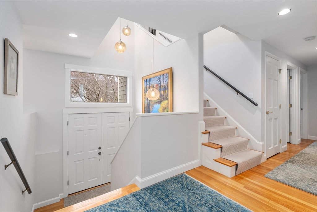 81 Woodfall Road Belmont, MA 02478 - Photo 2 of 37 a view of entryway with stairs and wooden floor