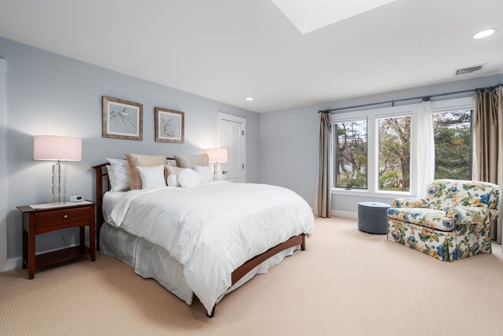 81 Woodfall Road Belmont, MA 02478 - Photo 23 of 37 a spacious bedroom with a bed and a couch