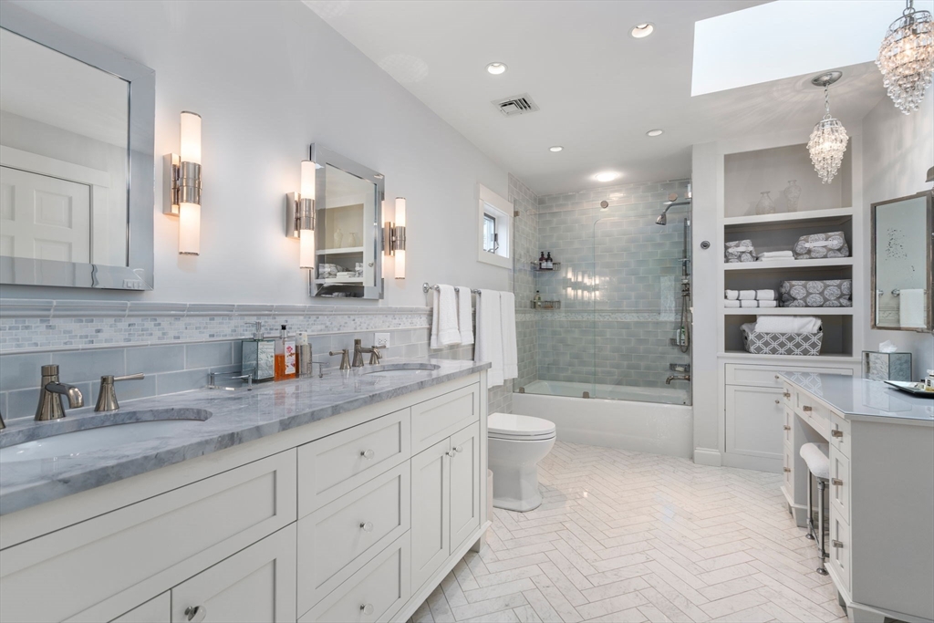 81 Woodfall Road Belmont, MA 02478 - Photo 24 of 37 a bathroom with a granite countertop sink mirror bathtub shower and toilet