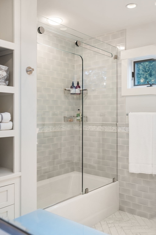 81 Woodfall Road Belmont, MA 02478 - Photo 25 of 37 a bathroom with a shower and a bath tub