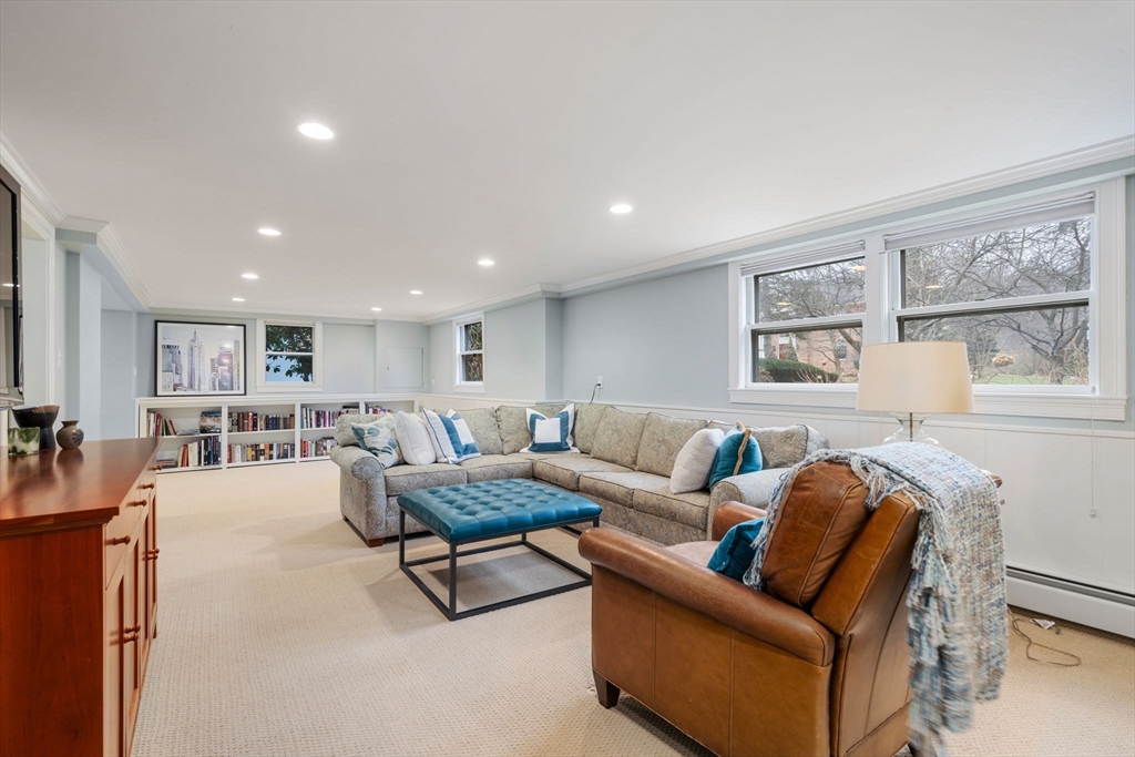 81 Woodfall Road Belmont, MA 02478 - Photo 27 of 37 a living room with furniture and a table