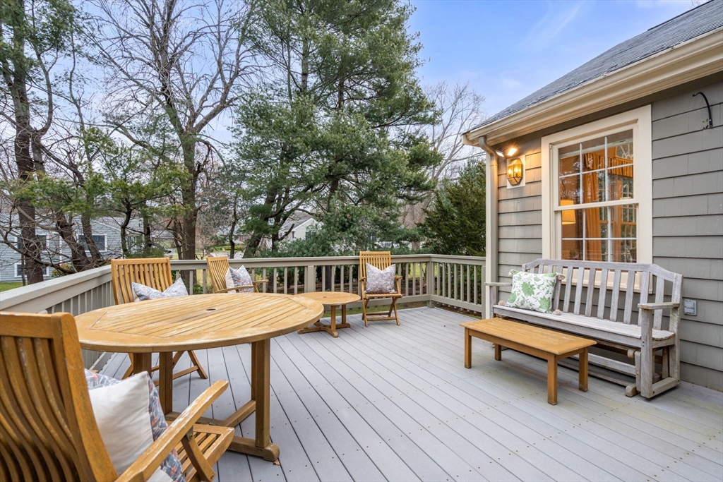 81 Woodfall Road Belmont, MA 02478 - Photo 31 of 37 a view of a patio with a table and chairs