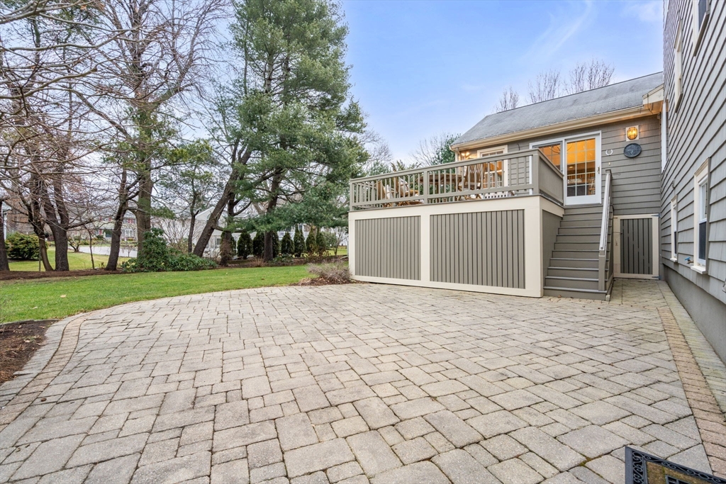 81 Woodfall Road Belmont, MA 02478 - Photo 32 of 37 a view of a white house with a yard