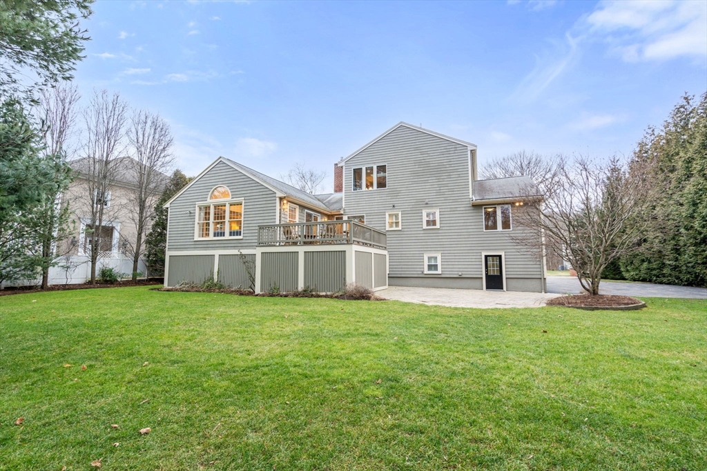 81 Woodfall Road Belmont, MA 02478 - Photo 33 of 37 a view of a house with a big yard and large trees
