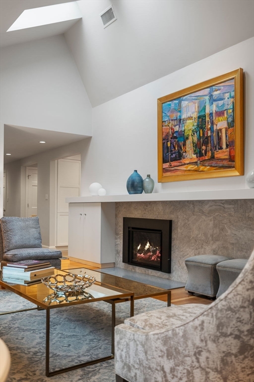 81 Woodfall Road Belmont, MA 02478 - Photo 4 of 37 a living room with furniture and a fireplace
