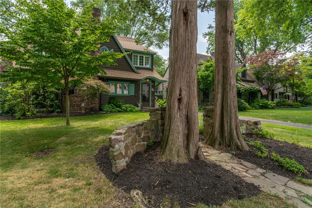 36 Hathaway Road Irondequoit, NY 14617 - Photo 2 of 19 Enchanting pathway to the front of the house