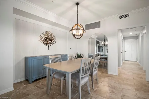 a view of a dining room and chandelier