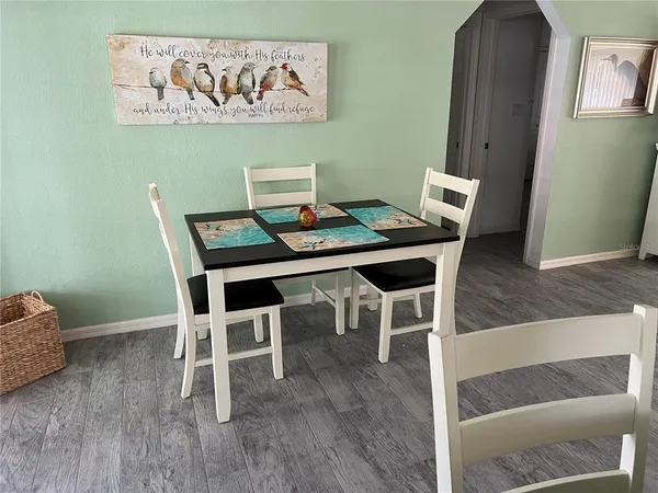a workspace with furniture and wooden floor