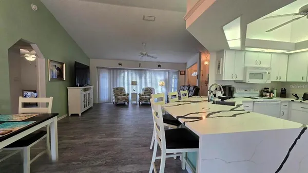 a view of kitchen dining table and chairs