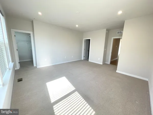 a view of hallway with a large window