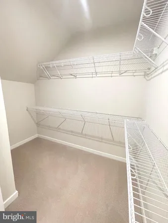 a view of a room with racks on the wall