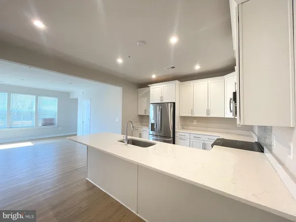 a bathroom with a sink and a large mirror