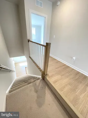 a view of balcony with wooden floor