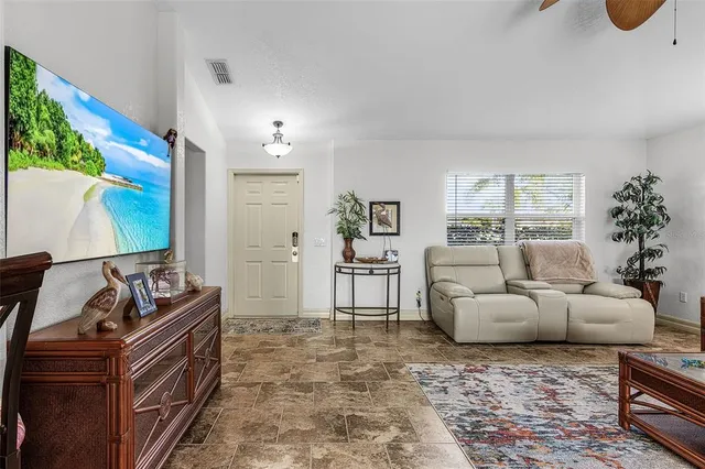 a view of a dining room with furniture and a window