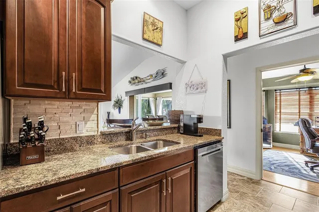 a view of a house with a backyard