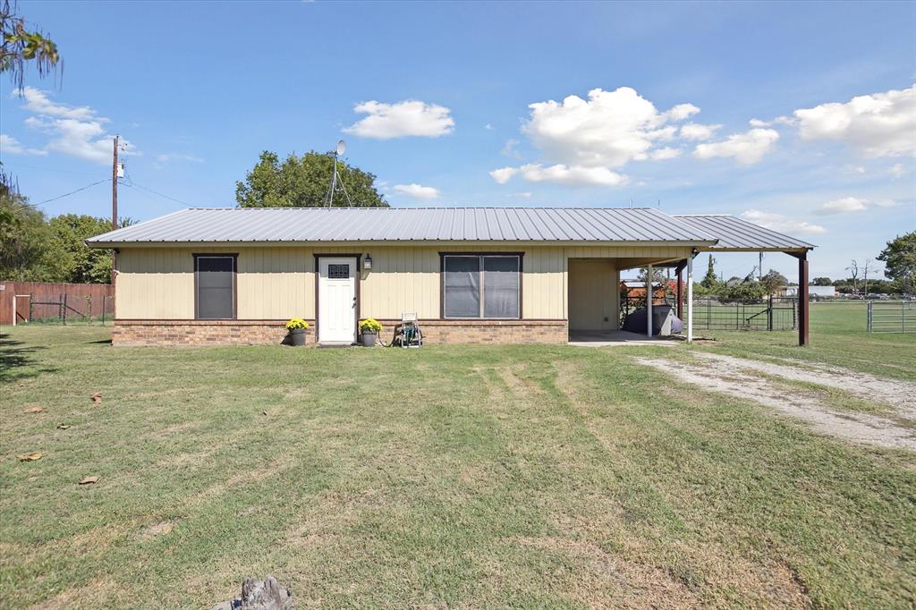 1305 Hutchins Lane Springtown, TX 76082 - Photo 1 of 1 a view of a house with a backyard
