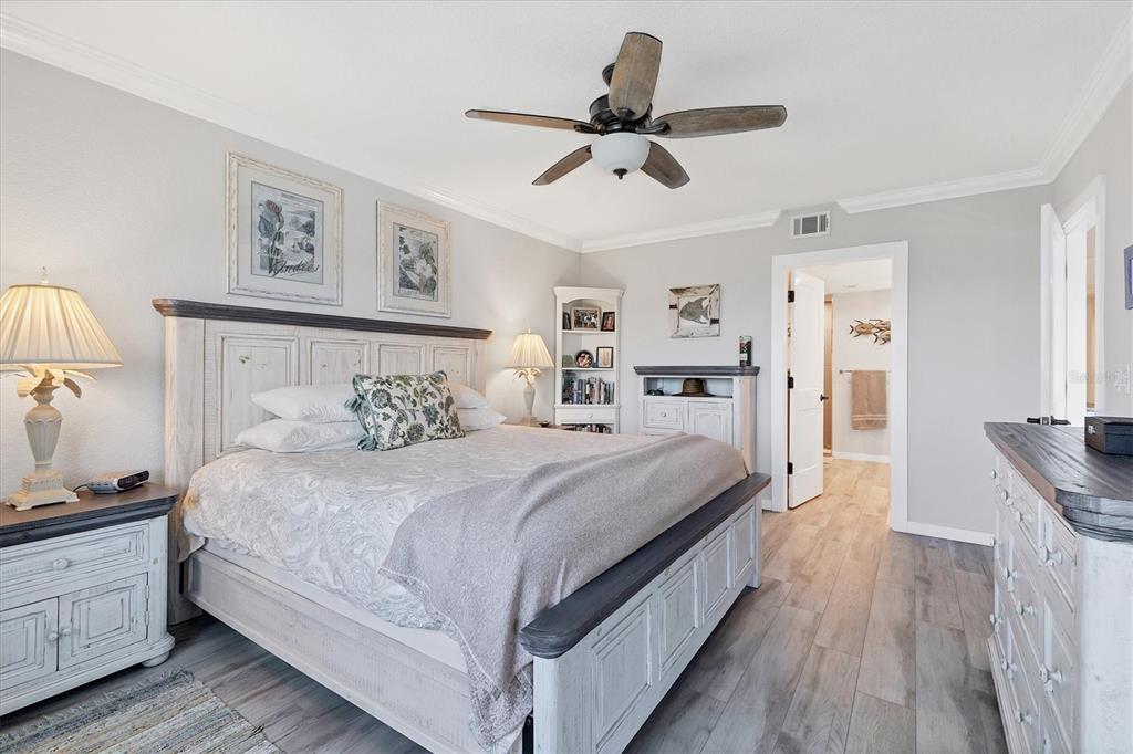 11000 Placida Road, Unit 302 Placida, FL 33946 - Photo 22 of 68 a bedroom with bed and wooden floor