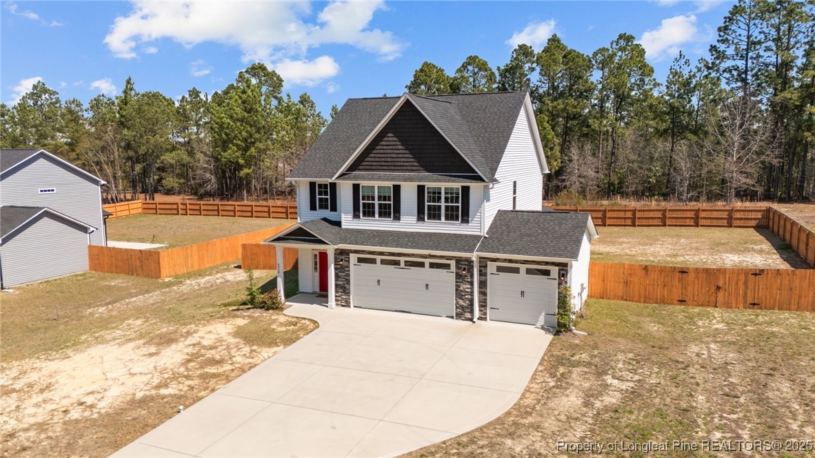 6438 Calloway Road Aberdeen, NC 28315 - Photo 1 of 50 a view of a house with a outdoor space