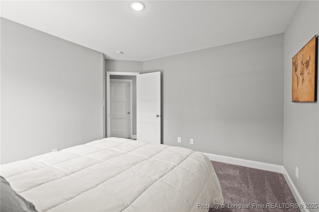 6438 Calloway Road Aberdeen, NC 28315 - Photo 28 of 50 a bedroom with a bed and a window