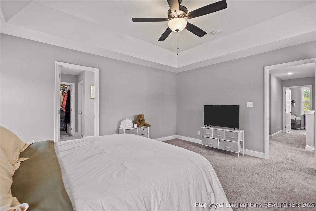 6438 Calloway Road Aberdeen, NC 28315 - Photo 31 of 50 a bedroom with a bed and a flat screen tv