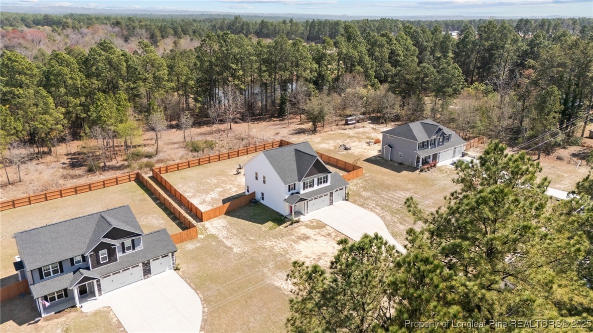 6438 Calloway Road Aberdeen, NC 28315 - Photo 42 of 50 an aerial view of a house with yard and seating space