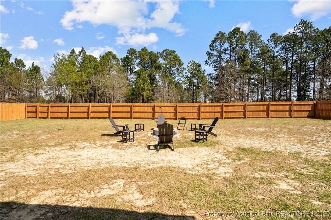 6438 Calloway Road Aberdeen, NC 28315 - Photo 44 of 50 a view of a swimming pool with an outdoor seating