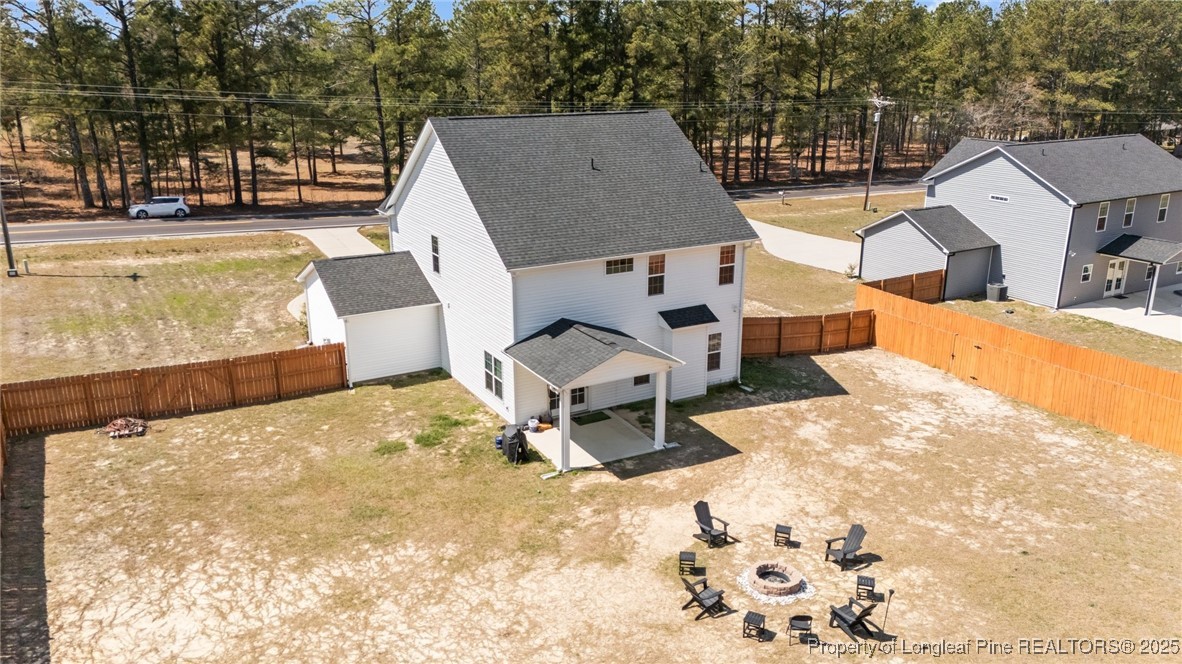 6438 Calloway Road Aberdeen, NC 28315 - Photo 49 of 50 a view of a swimming pool with a lounge chairs