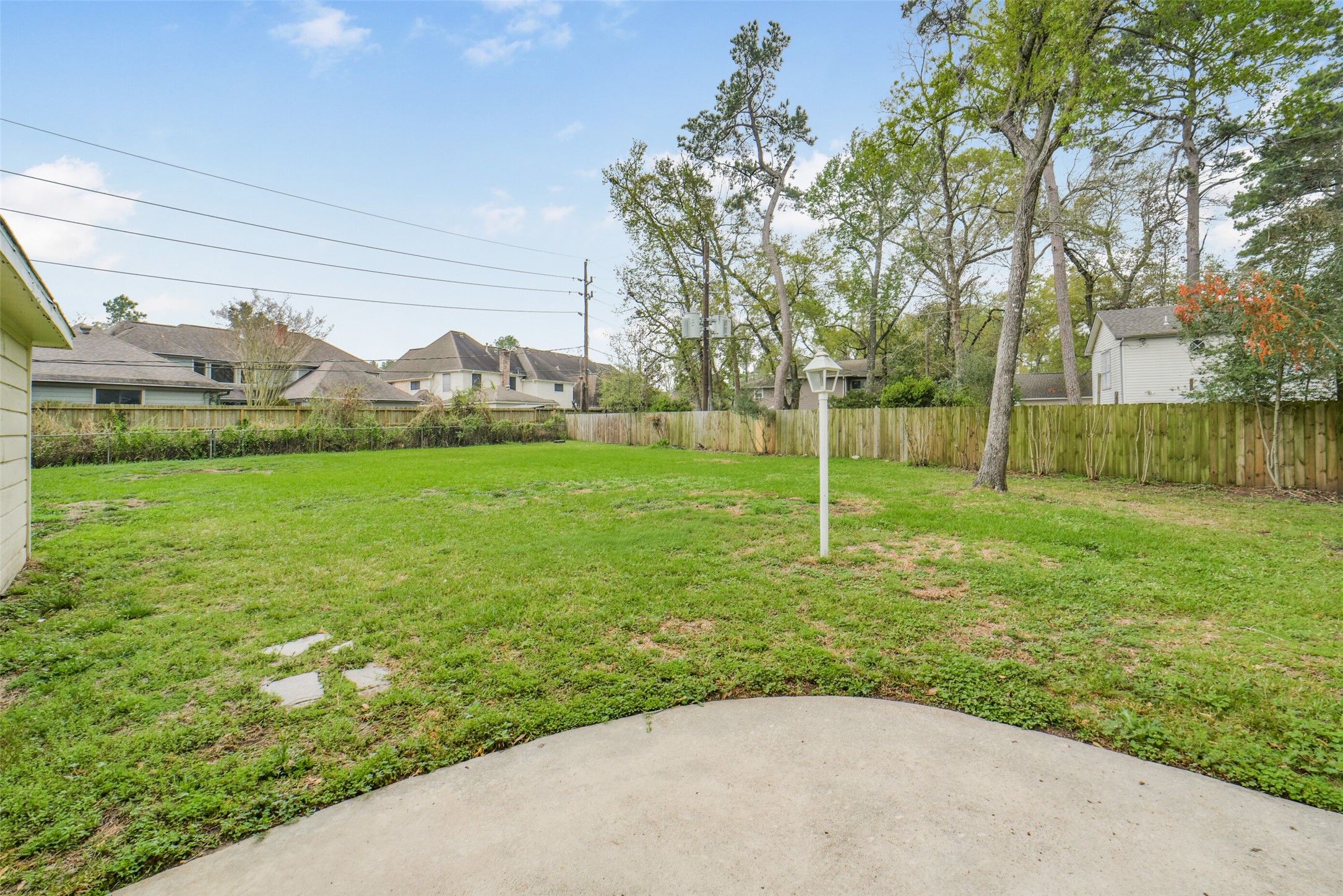 7611 Theisswood Road Spring, TX 77379 - Photo 33 of 41 Charming two-story brick home with a welcoming pathway and mature trees.