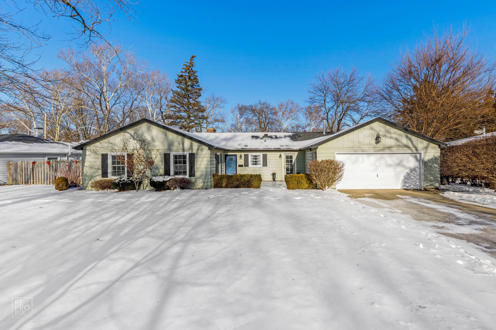 409 Bridle Lane Wheaton, IL 60187 - Photo 1 of 10 a front view of a house with a yard and garage