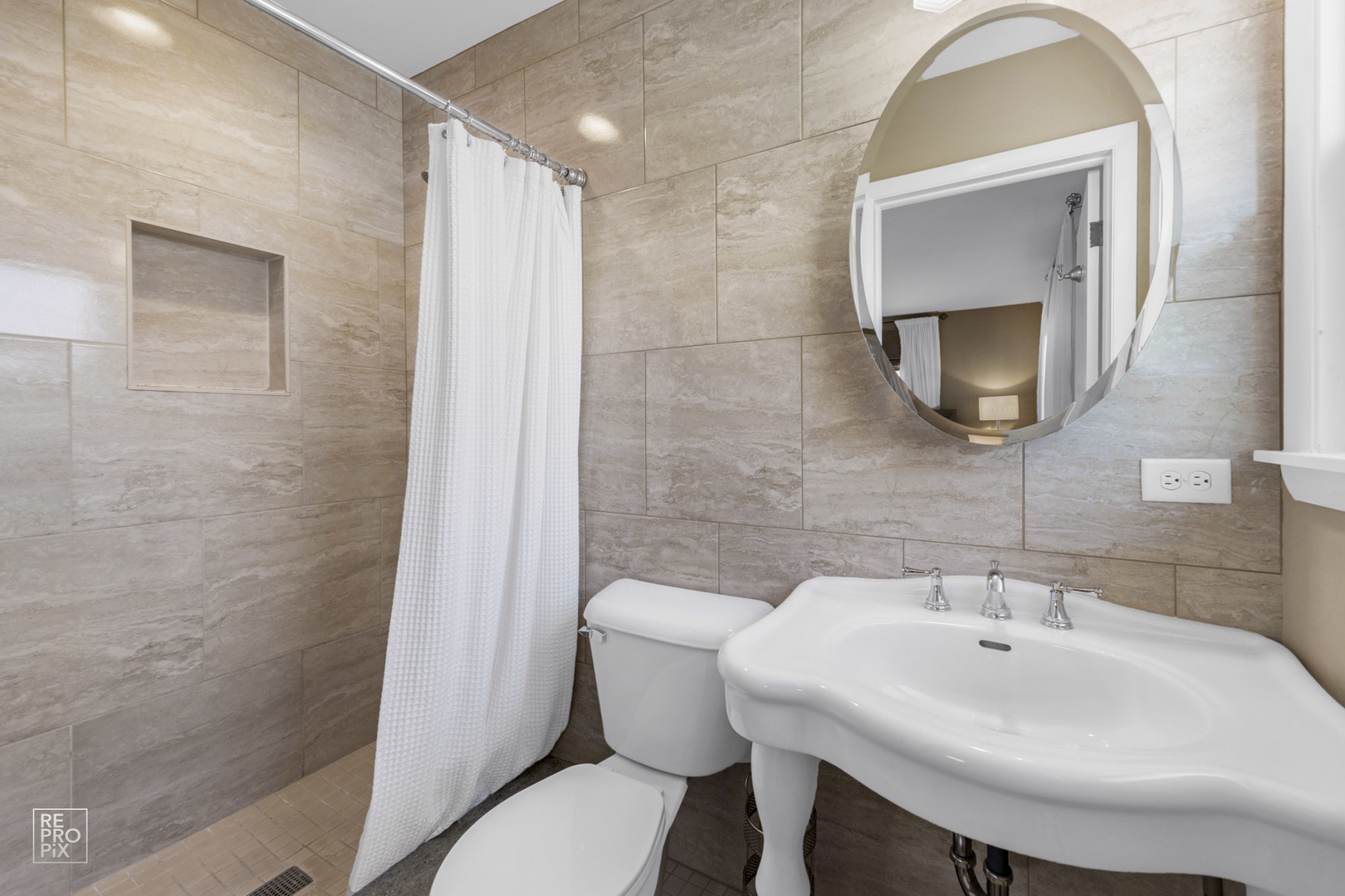 409 Bridle Lane Wheaton, IL 60187 - Photo 7 of 10 a bathroom with a sink and a mirror