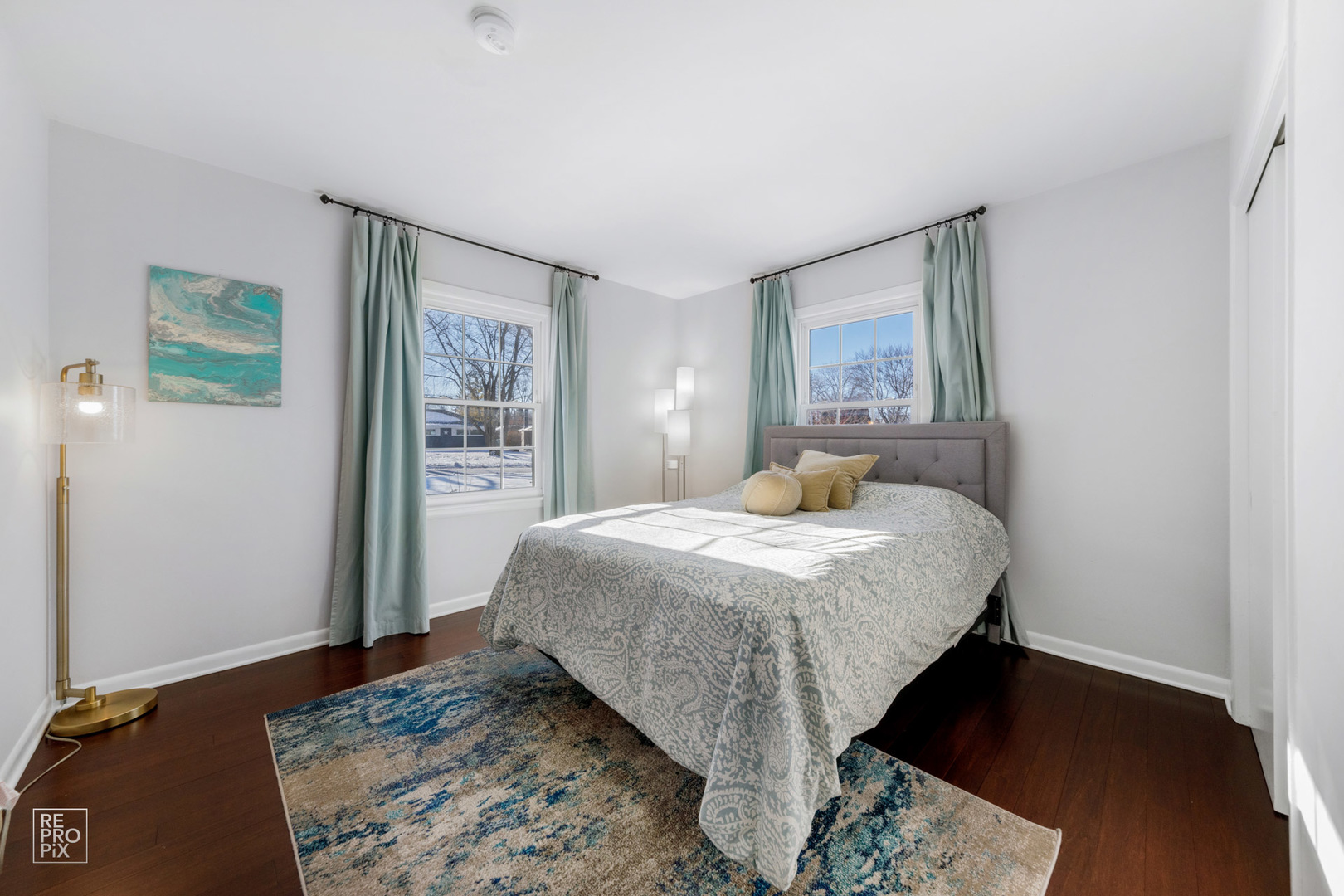 409 Bridle Lane Wheaton, IL 60187 - Photo 9 of 10 a bedroom with a bed and a dresser