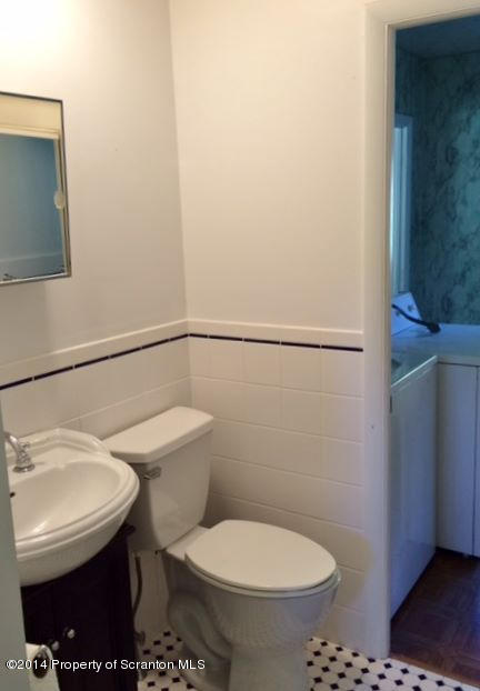 374 Maple Lake Road Moscow, PA 18444 - Photo 15 of 36 a white toilet sitting next to a bathroom sink