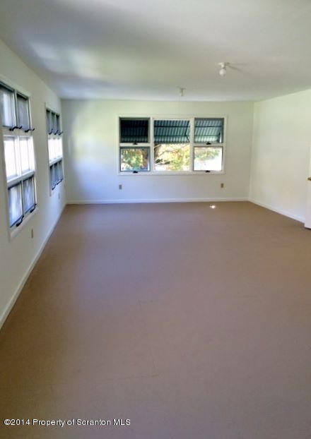 374 Maple Lake Road Moscow, PA 18444 - Photo 17 of 36 a view of an empty room with a window