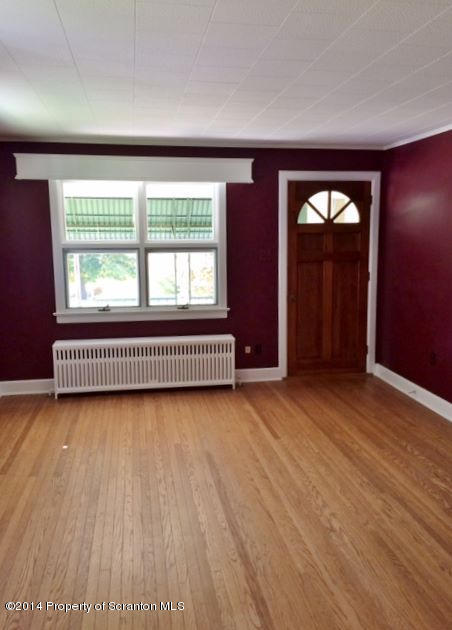 374 Maple Lake Road Moscow, PA 18444 - Photo 2 of 36 an empty room with wooden floor and windows