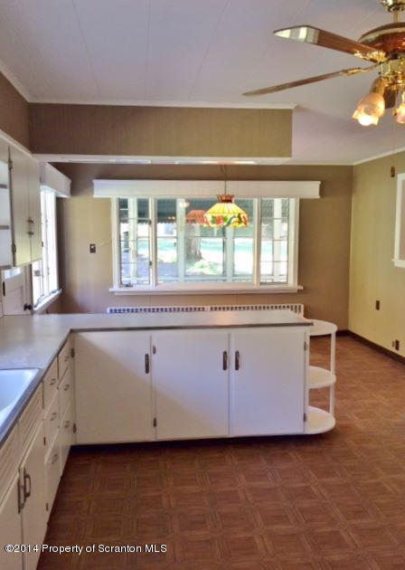 374 Maple Lake Road Moscow, PA 18444 - Photo 3 of 36 a utility room with stainless steel appliances wooden floor and large window