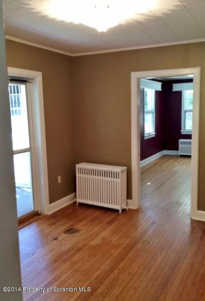 374 Maple Lake Road Moscow, PA 18444 - Photo 4 of 36 a view of a room with wooden floor and stairs