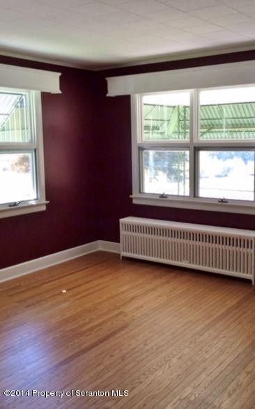 374 Maple Lake Road Moscow, PA 18444 - Photo 5 of 36 a view of a room with wooden floor and windows
