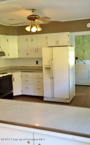 374 Maple Lake Road Moscow, PA 18444 - Photo 6 of 36 a view of a kitchen with a sink and cabinets