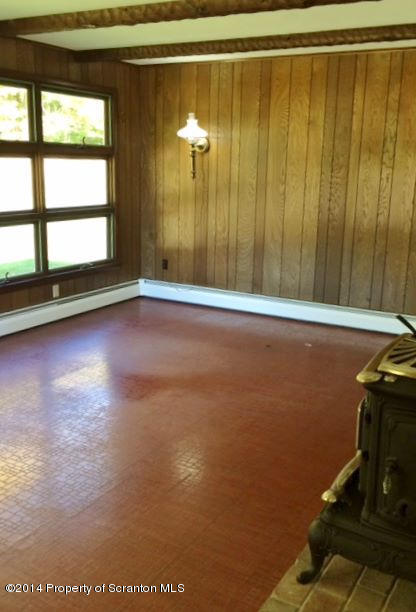 374 Maple Lake Road Moscow, PA 18444 - Photo 7 of 36 a view of a room with wooden floor and windows