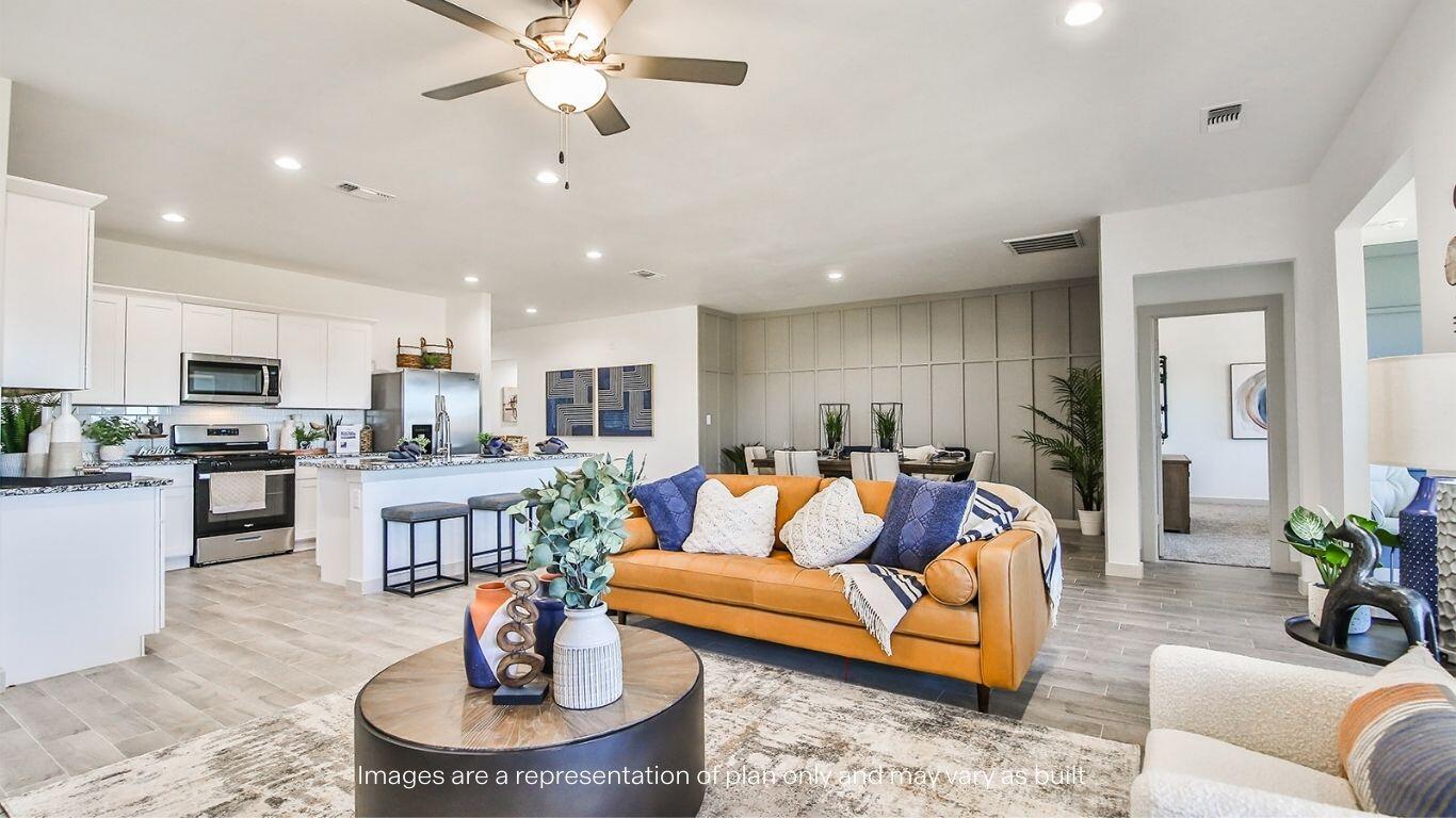 2921 138th Place Lubbock, TX 79423 - Photo 11 of 29 a living room with furniture kitchen view and a chandelier