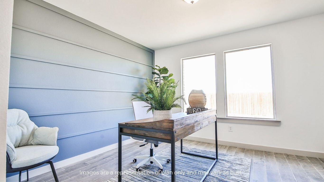 2921 138th Place Lubbock, TX 79423 - Photo 13 of 29 a workspace with furniture and a potted plant