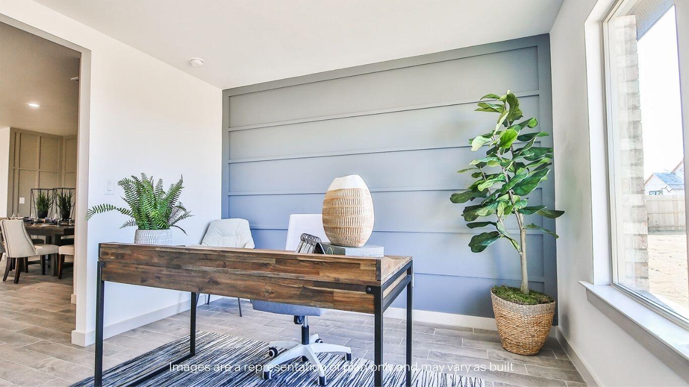 2921 138th Place Lubbock, TX 79423 - Photo 14 of 29 a dining room with furniture a potted plant and a window