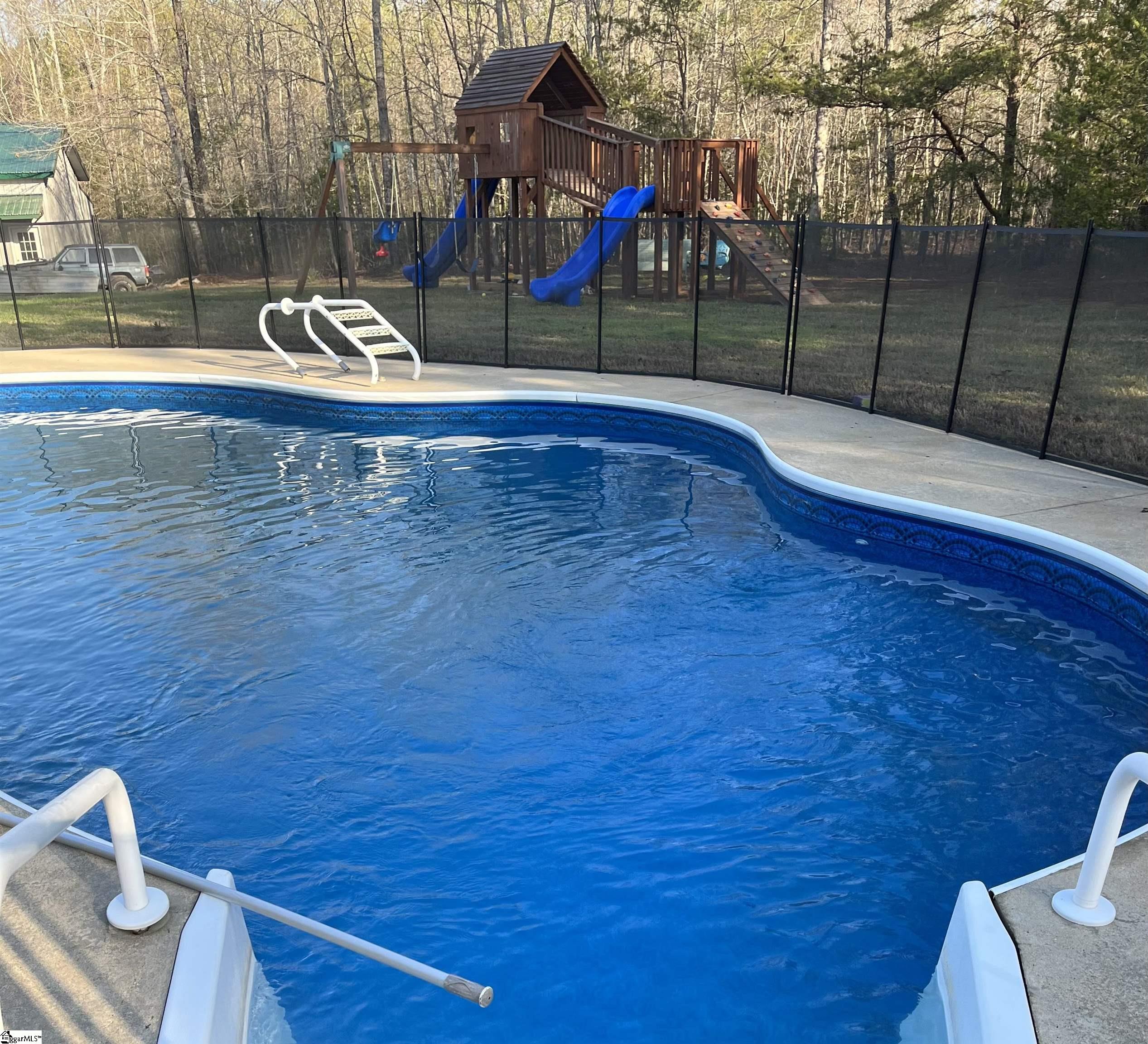4682 Howe Road Landrum, SC 29356 - Photo 30 of 31 WWW.POOLFENCE.COM Removable fence remains with home.