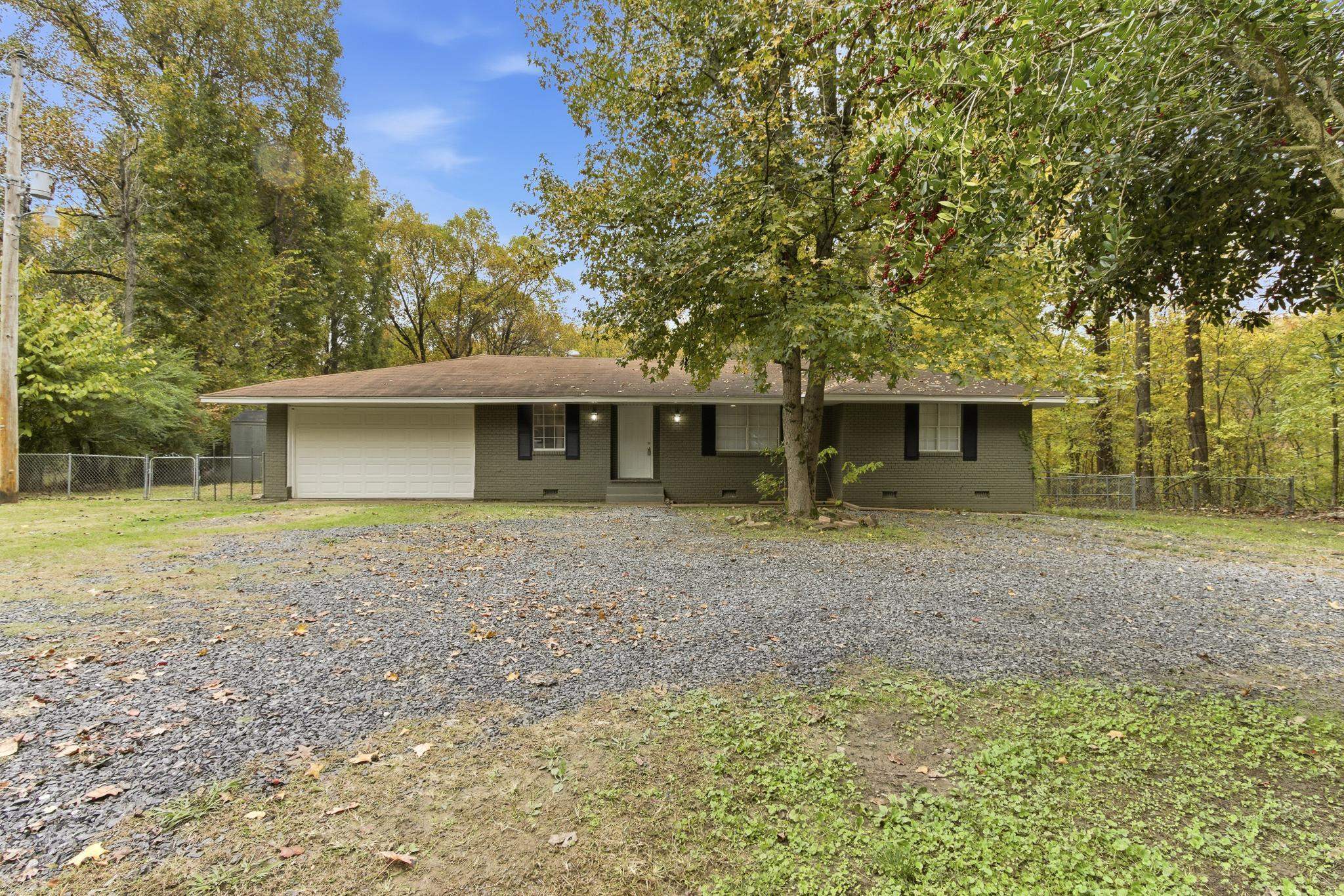 5002 Benjestown Road Memphis, TN 38127 - Photo 1 of 29 Single story home featuring an attached garage, brick siding, crawl space, and driveway