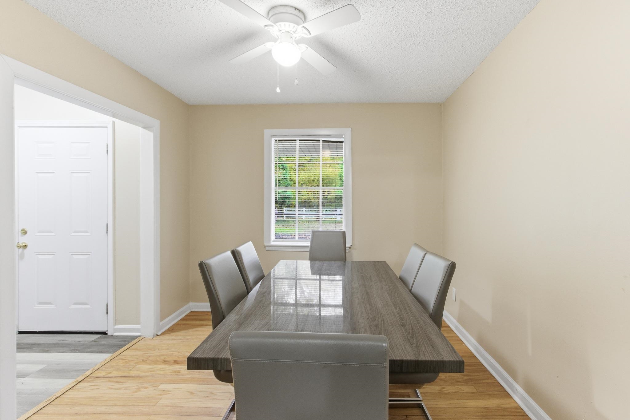 5002 Benjestown Road Memphis, TN 38127 - Photo 14 of 29 Dining space featuring light wood-type flooring, a textured ceiling, and ceiling fan