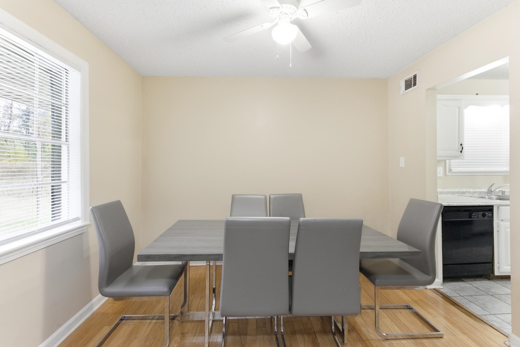 5002 Benjestown Road Memphis, TN 38127 - Photo 15 of 29 Dining space featuring light wood-style floors, a ceiling fan, and a textured ceiling