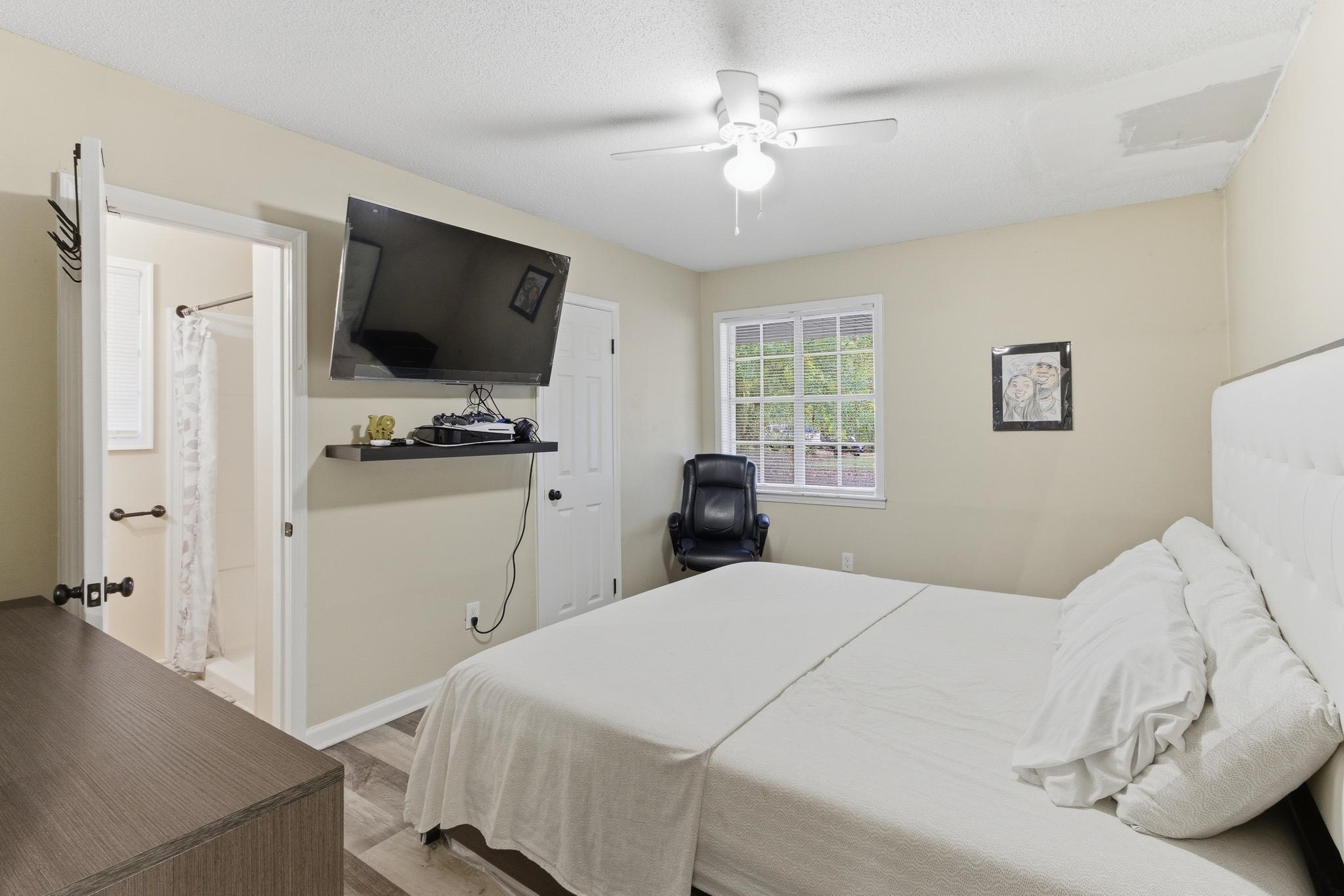 5002 Benjestown Road Memphis, TN 38127 - Photo 16 of 29 Bedroom featuring light wood finished floors and a ceiling fan