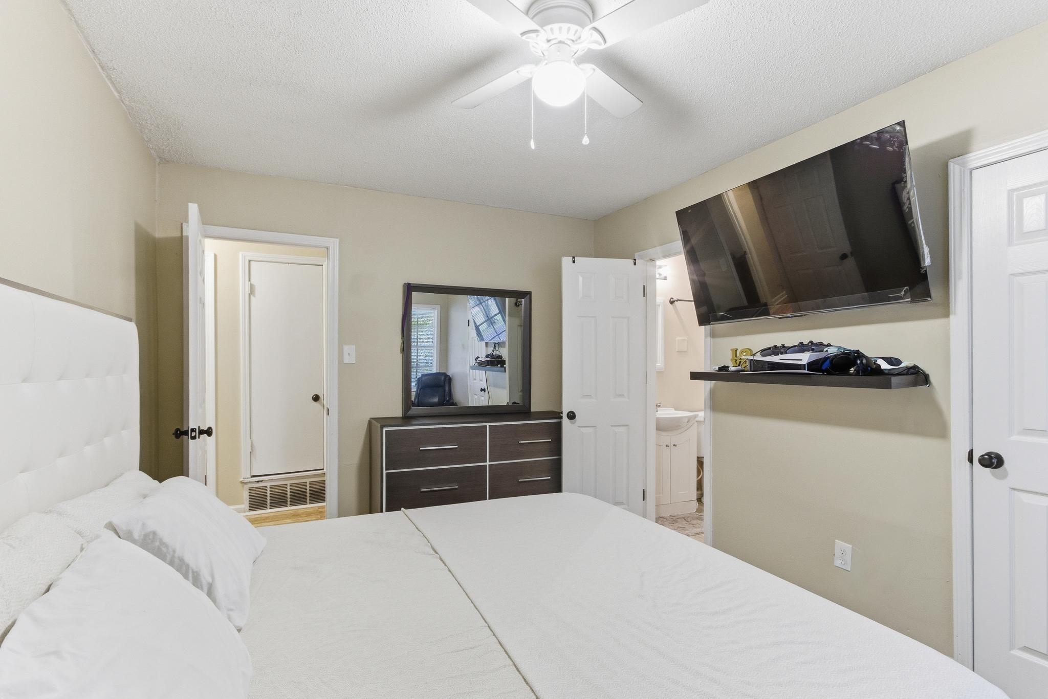 5002 Benjestown Road Memphis, TN 38127 - Photo 17 of 29 Bedroom with a ceiling fan and a textured ceiling