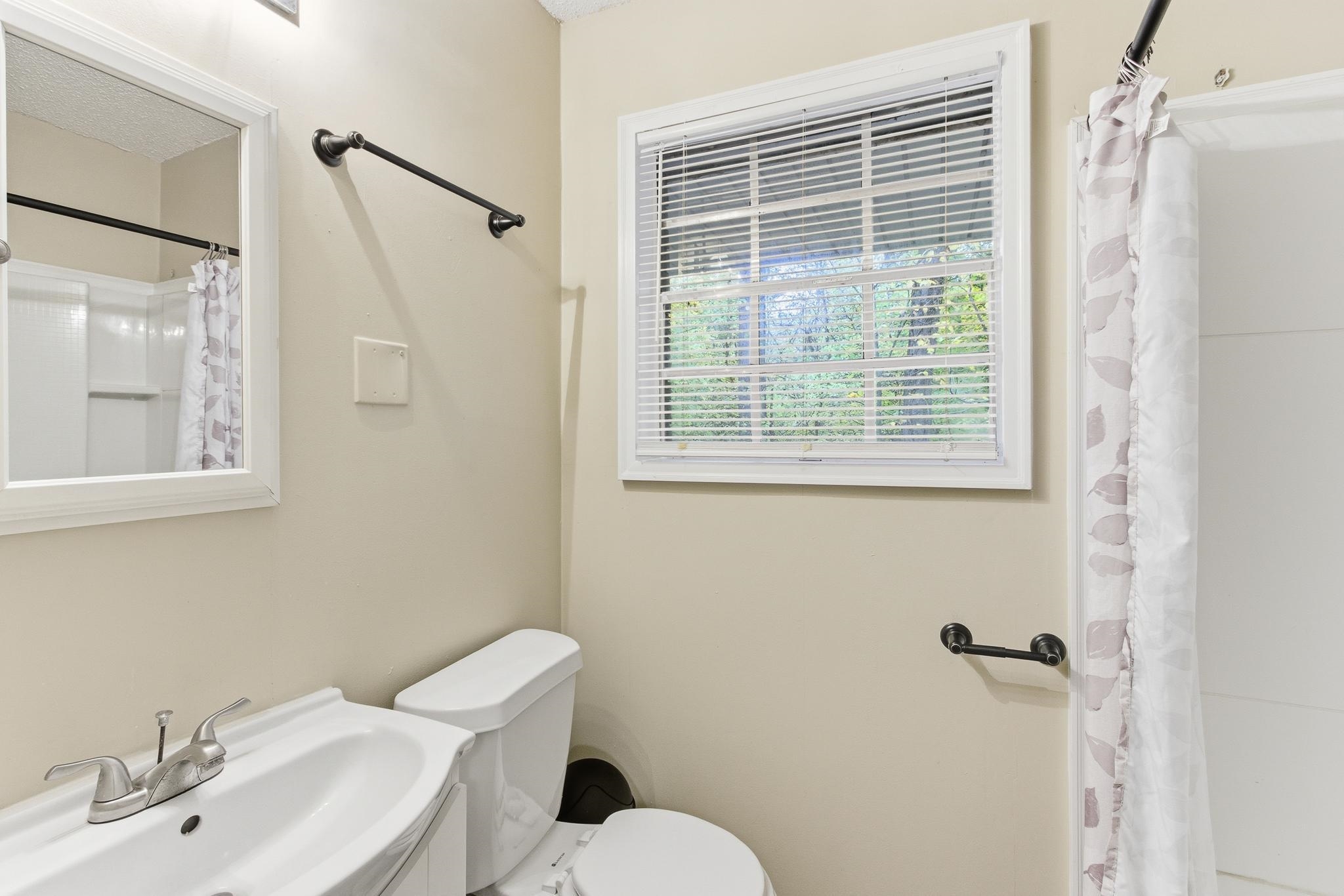 5002 Benjestown Road Memphis, TN 38127 - Photo 19 of 29 Full bathroom with a shower with curtain and vanity